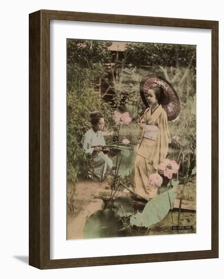 Two Young Japanese Girls, One Holding a Parasol, with Lotus Flowers-null-Framed Photographic Print