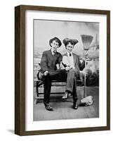 Two Young Men on a Bench with a Broom, Ca. 1900-null-Framed Photographic Print