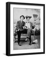 Two Young Men on a Bench with a Broom, Ca. 1900-null-Framed Photographic Print