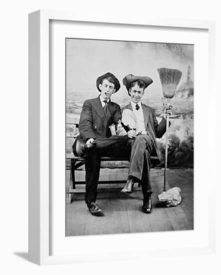 Two Young Men on a Bench with a Broom, Ca. 1900-null-Framed Photographic Print