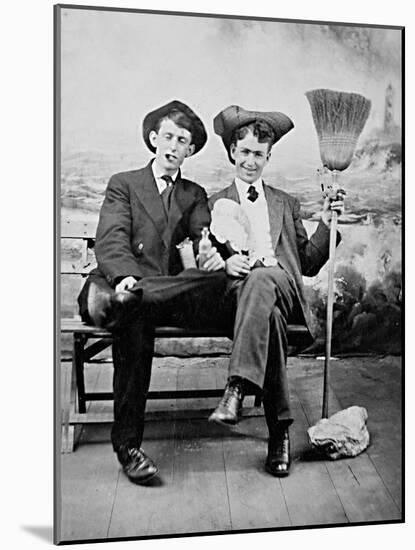 Two Young Men on a Bench with a Broom, Ca. 1900-null-Mounted Photographic Print