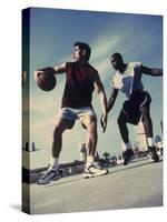 Two Young Men Playing Basketball-null-Stretched Canvas
