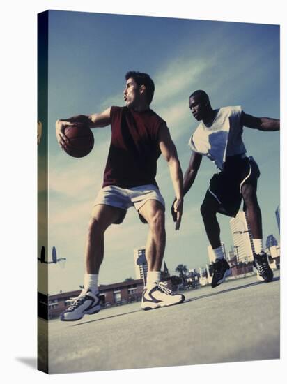 Two Young Men Playing Basketball-null-Stretched Canvas