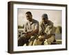 Two Young Men Sitting on The Pier Fishing-null-Framed Photographic Print