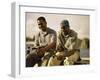 Two Young Men Sitting on The Pier Fishing-null-Framed Photographic Print