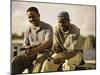 Two Young Men Sitting on The Pier Fishing-null-Mounted Photographic Print