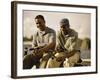 Two Young Men Sitting on The Pier Fishing-null-Framed Photographic Print