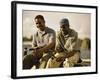 Two Young Men Sitting on The Pier Fishing-null-Framed Photographic Print