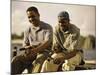 Two Young Men Sitting on The Pier Fishing-null-Mounted Photographic Print