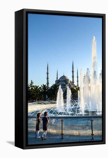 Two Young Turkish Girls Pointing to the Blue Mosque, UNESCO World Heritage Site-James Strachan-Framed Stretched Canvas