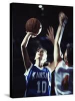 Two Young Women Playing Basketball-null-Stretched Canvas