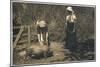 Two Young Women Tend to Pigs in Their Pen-null-Mounted Art Print