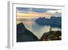 Two young women watching sunset standing on mountain top, Senja island, Troms county-Roberto Moiola-Framed Photographic Print