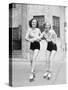 Two Young Women with Roller Blades Skating on the Road and Smiling-null-Stretched Canvas