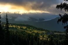 Freestyle skier doing a trick off a jump above city at sunset, Canada, North America-Tyler Lillico-Stretched Canvas