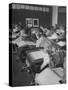 Typical 10 Year Old Girls Known as " Pigtailers" Sitting in Classroom-Frank Scherschel-Stretched Canvas