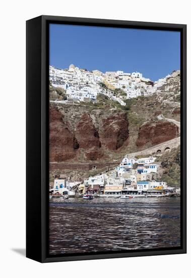 Typical Greek Village Perched on Volcanic Rock with White and Blue Houses and Windmills, Santorini-Roberto Moiola-Framed Stretched Canvas