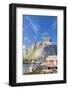 Typical house of fishermen called Rorbu framed by rocky peaks and blue sea, Reine, Moskenesoya, Lof-Roberto Moiola-Framed Photographic Print