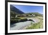 Typical red Swiss train on Hospental Viadukt surrounded by creek and green meadows, Andermatt, Cant-Roberto Moiola-Framed Photographic Print