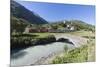 Typical red Swiss train on Hospental Viadukt surrounded by creek and green meadows, Andermatt, Cant-Roberto Moiola-Mounted Photographic Print