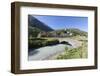 Typical red Swiss train on Hospental Viadukt surrounded by creek and green meadows, Andermatt, Cant-Roberto Moiola-Framed Photographic Print