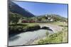 Typical red Swiss train on Hospental Viadukt surrounded by creek and green meadows, Andermatt, Cant-Roberto Moiola-Mounted Photographic Print