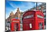 Typical Red Telephone Boxes on Brompton Road with Harrods Building on the Background-Felipe Rodriguez-Mounted Photographic Print