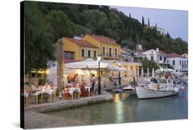 Typical Waterfront Taverna Illuminated at Dusk, Kioni, Ithaca (Ithaki)-Ruth Tomlinson-Stretched Canvas