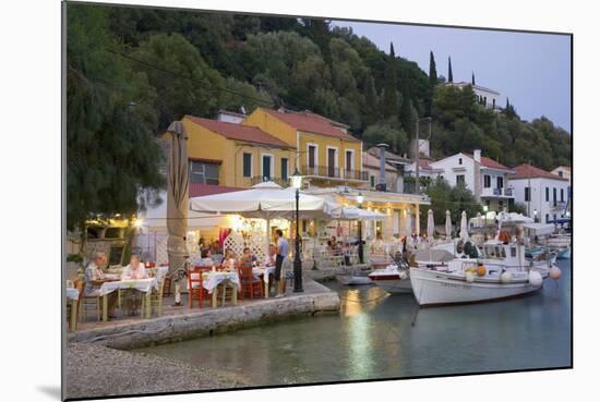 Typical Waterfront Taverna Illuminated at Dusk, Kioni, Ithaca (Ithaki)-Ruth Tomlinson-Mounted Photographic Print