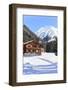 Typical wooden hut framed by woods and snowy peaks, Langwies, district of Plessur, Canton of Graubu-Roberto Moiola-Framed Photographic Print