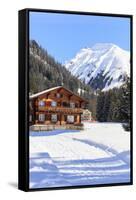 Typical wooden hut framed by woods and snowy peaks, Langwies, district of Plessur, Canton of Graubu-Roberto Moiola-Framed Stretched Canvas