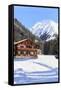 Typical wooden hut framed by woods and snowy peaks, Langwies, district of Plessur, Canton of Graubu-Roberto Moiola-Framed Stretched Canvas