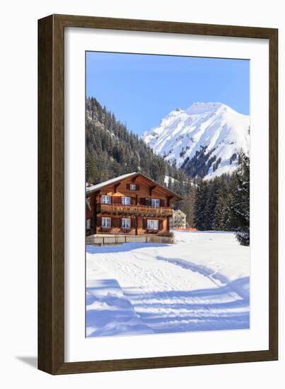 Typical wooden hut framed by woods and snowy peaks, Langwies, district of Plessur, Canton of Graubu-Roberto Moiola-Framed Photographic Print