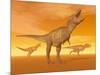 Tyrannosaurus Rex Dinosaurs in an Orange Foggy Desert by Sunset-null-Mounted Art Print