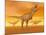 Tyrannosaurus Rex Dinosaurs in an Orange Foggy Desert by Sunset-null-Mounted Art Print