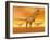 Tyrannosaurus Rex Dinosaurs in an Orange Foggy Desert by Sunset-null-Framed Art Print