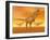 Tyrannosaurus Rex Dinosaurs in an Orange Foggy Desert by Sunset-null-Framed Art Print