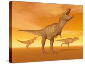 Tyrannosaurus Rex Dinosaurs in an Orange Foggy Desert by Sunset-null-Stretched Canvas