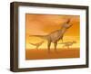 Tyrannosaurus Rex Dinosaurs in an Orange Foggy Desert by Sunset-null-Framed Art Print