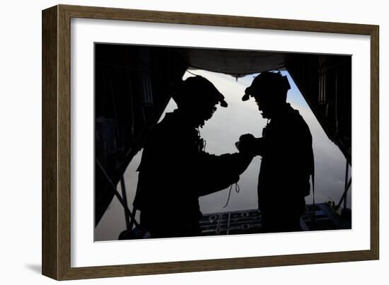 U.S. Air Force Loadmasters Fold the American Flag Aboard an Hc-130 Hercules-null-Framed Photographic Print