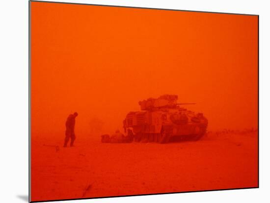 U.S. Army 3rd Infantry Division Sgt. Steven Brussel Leans into the Wind-null-Mounted Photographic Print