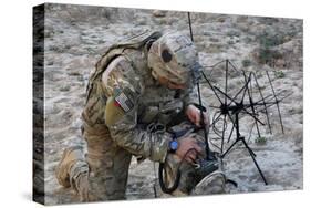U.S. Army Specialist Sets Up Radio Communications-null-Stretched Canvas