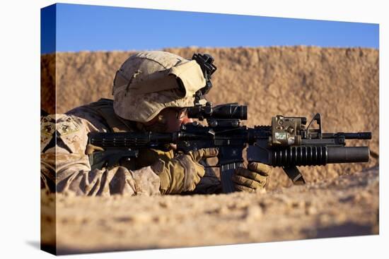 U.S. Marine Scans for Threats During a Firefight in Afghanistan-null-Stretched Canvas