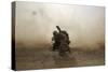 U.S. Marine Shields Himself from Dust Being Kicked Up from a Ch-53E Super Stallion-null-Stretched Canvas