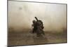 U.S. Marine Shields Himself from Dust Being Kicked Up from a Ch-53E Super Stallion-null-Mounted Photographic Print