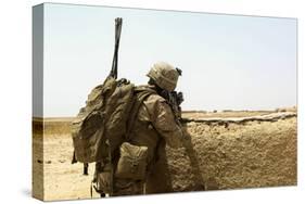 U.S. Marine Takes Cover Behind a Wall During a Patrol in Afghanistan-null-Stretched Canvas