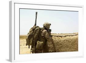 U.S. Marine Takes Cover Behind a Wall During a Patrol in Afghanistan-null-Framed Photographic Print