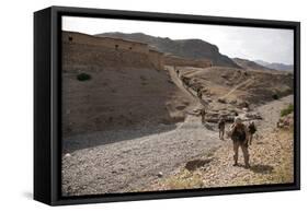 U.S. Marines Patrol Through a Village in Afghanistan-null-Framed Stretched Canvas