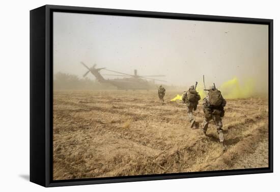 U.S. Marines Sprint across a Field to Load onto a Ch-53E Super Stallion-null-Framed Stretched Canvas