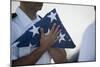 U.S. Navy Commanding Officer Holds the National Ensign-null-Mounted Photographic Print